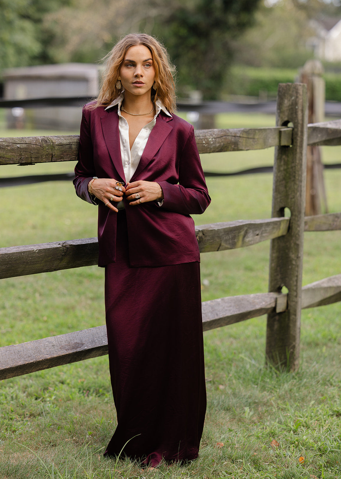 Women in Cabernet satin maxi skirt suit