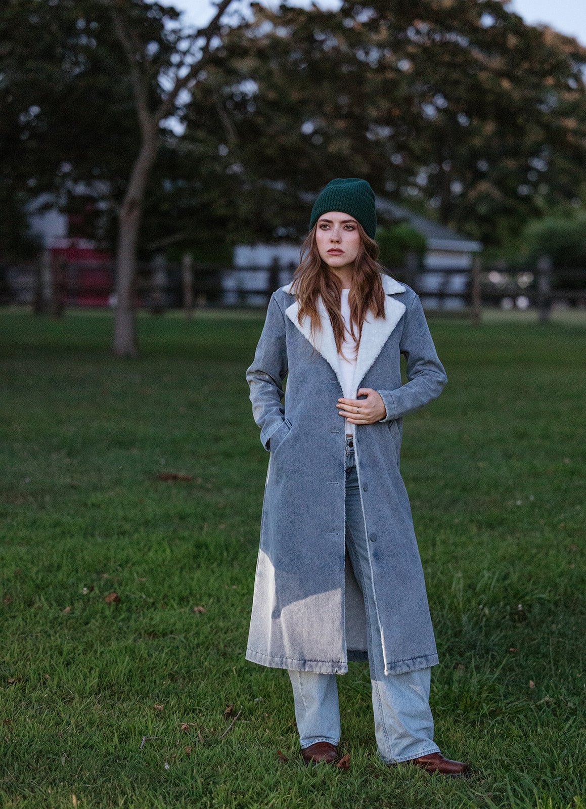 woman wearing a denim shearling trench coat