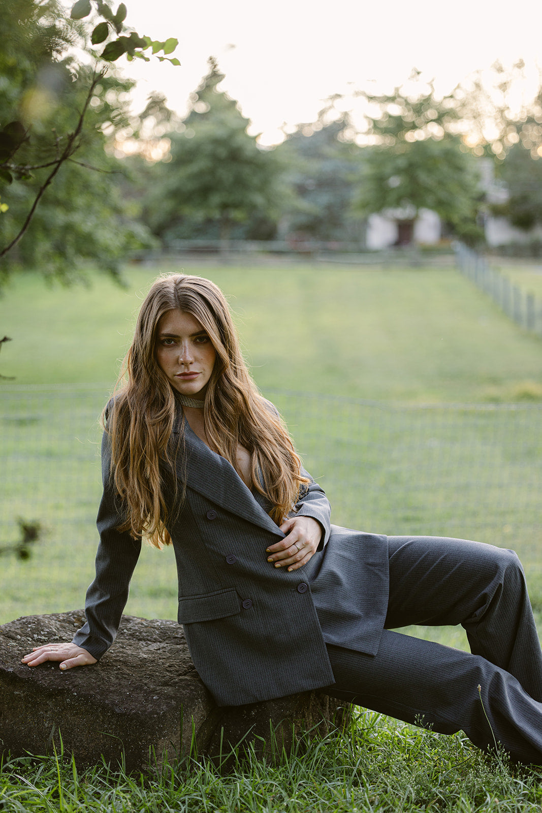 model wearing a grey pinstripe double breasted suit