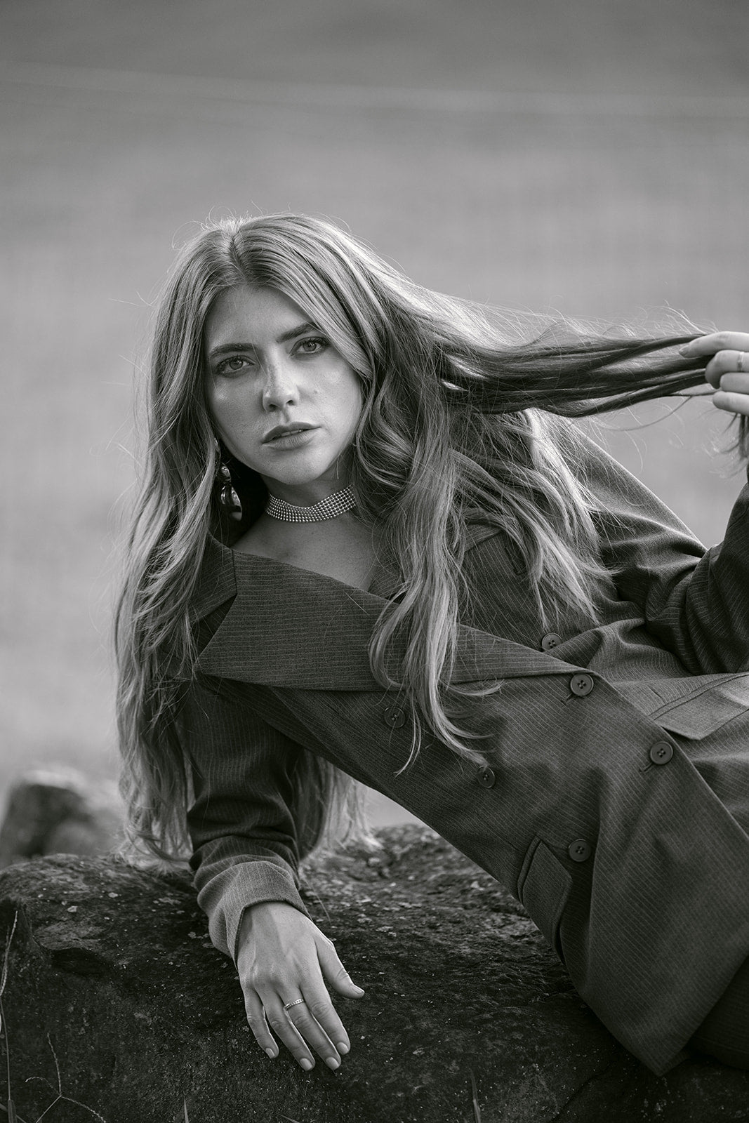 model wearing a grey pinstripe blazer 