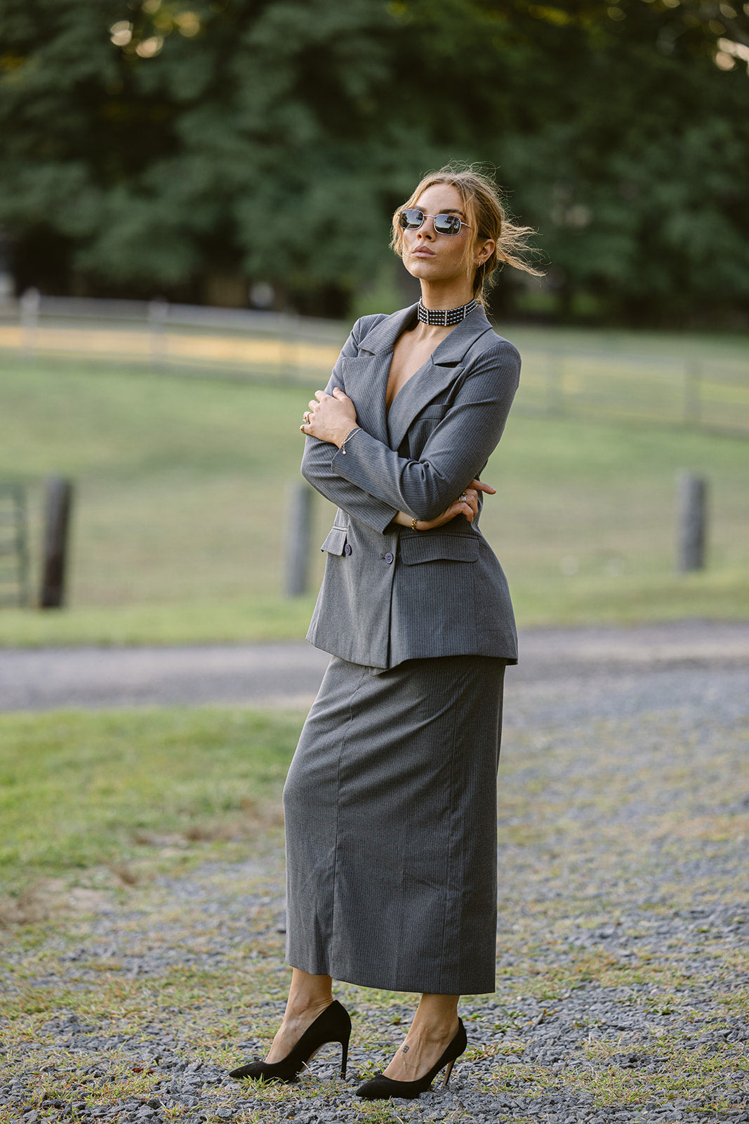 model wearing a grey pinstripe skirt suit
