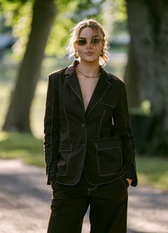 woman wearing a brown stitching blazer