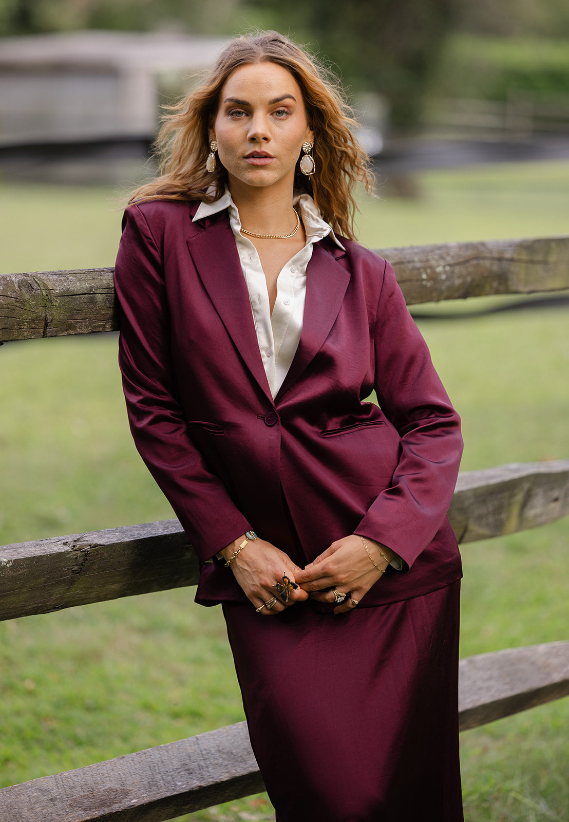 Model in Cabernet satin maxi skirt suit