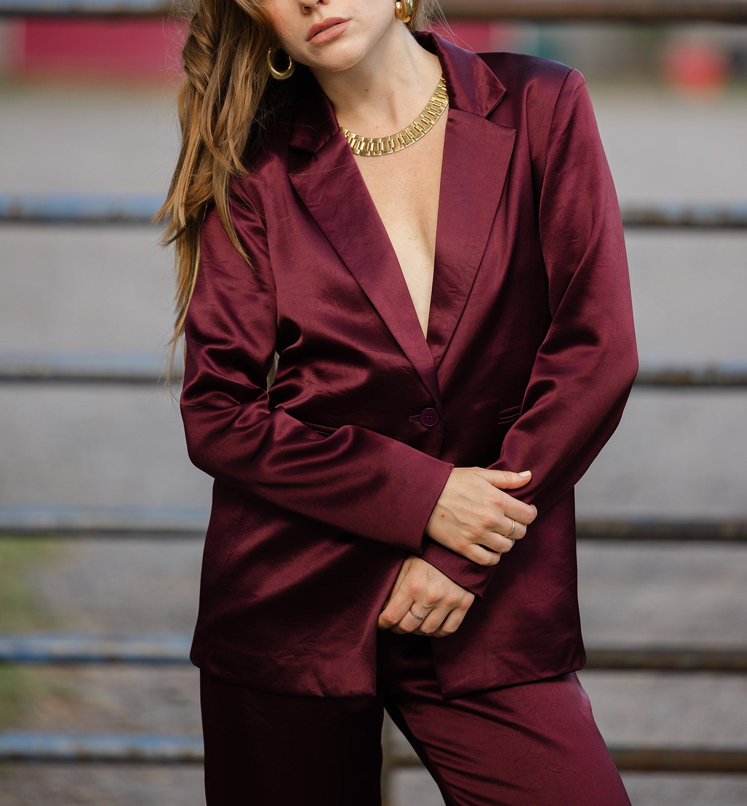 Woman in a cabernet satin blazer