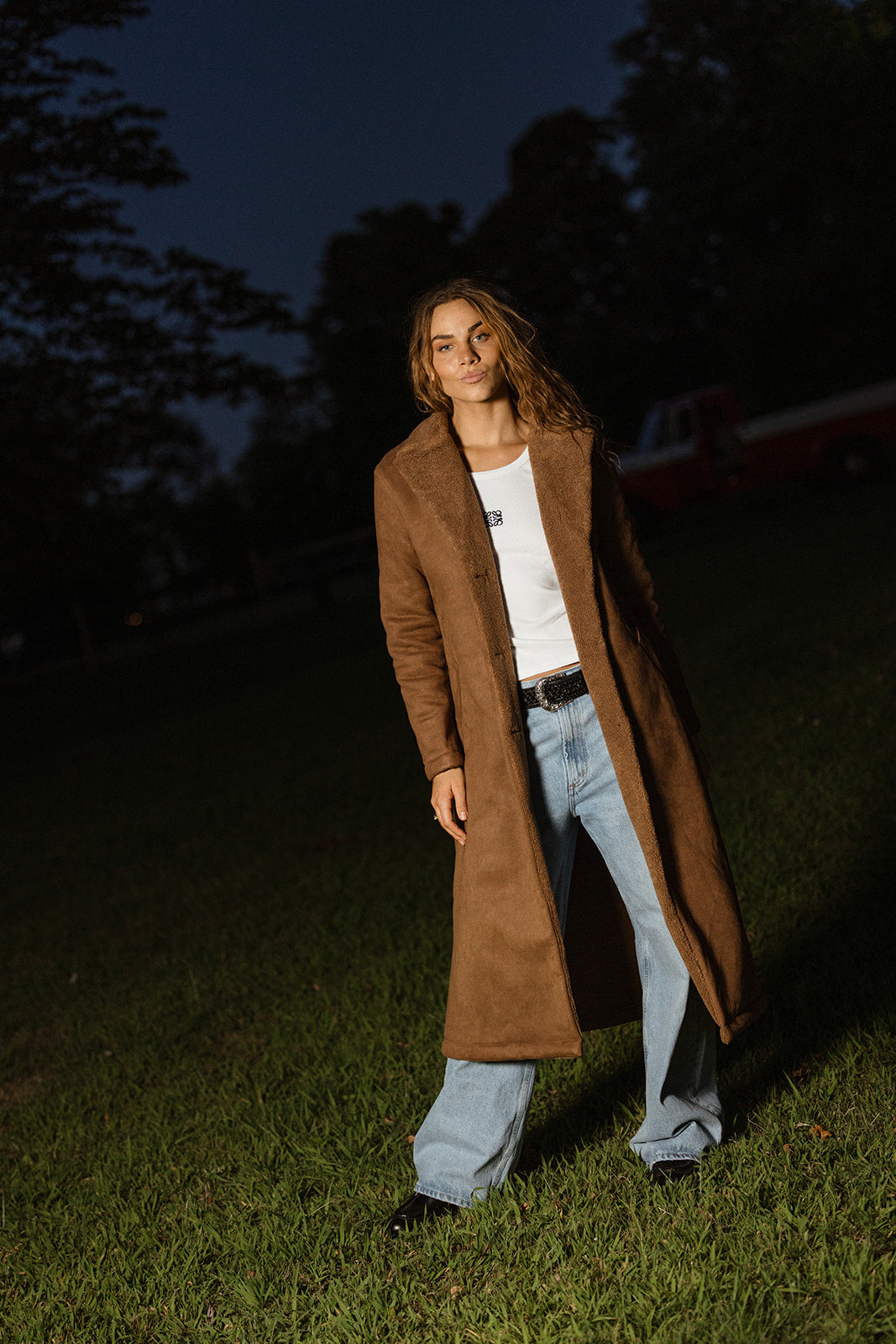 women wearing a brown suede shearling trench coat